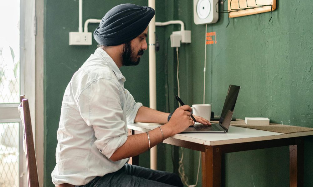 Candidate checking IISER IAT answer key on laptop