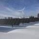 Adani Group renewable energy projects in 2025 with solar farms and wind turbines.